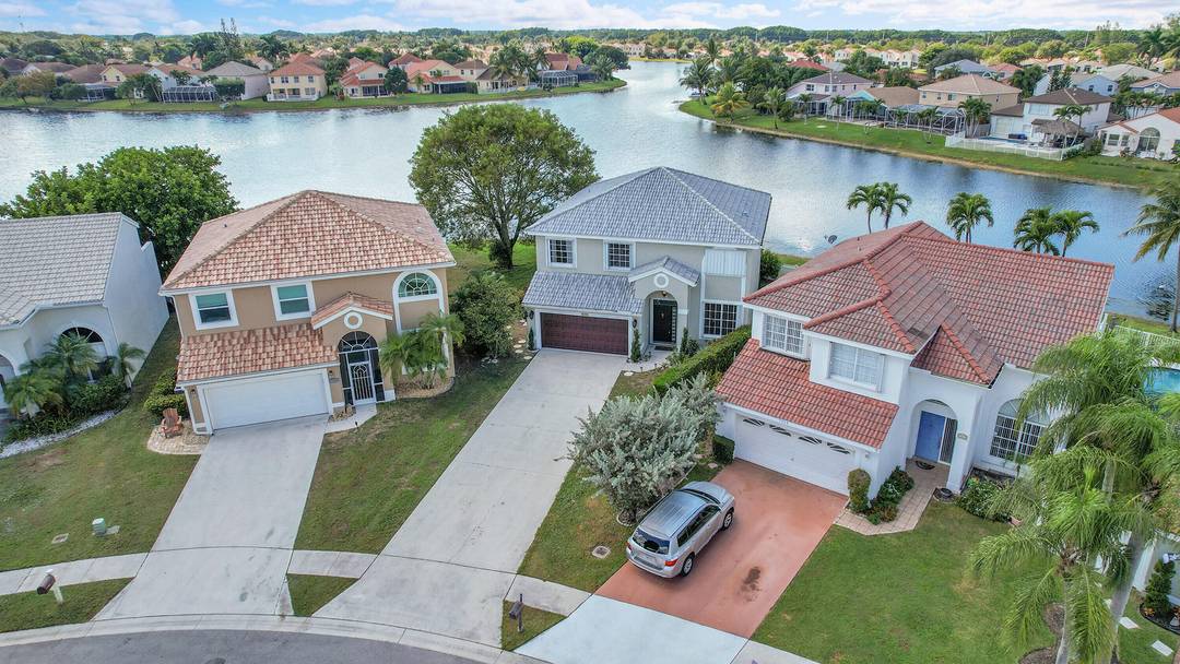 This 4 bedroom, 2. 5 bath home with a NEWER roof and NEWER A C offers stunning wood floors and panoramic lakefront views from the moment you walk in.