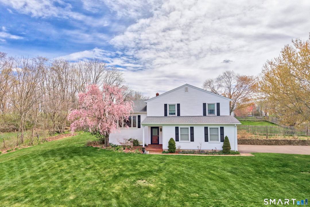 Set majestically on. 92 acres in a highly desirable neighborhood, this tastefully updated 3 bedroom, 3 full bath split level home offers refined living with a private driveway approach.