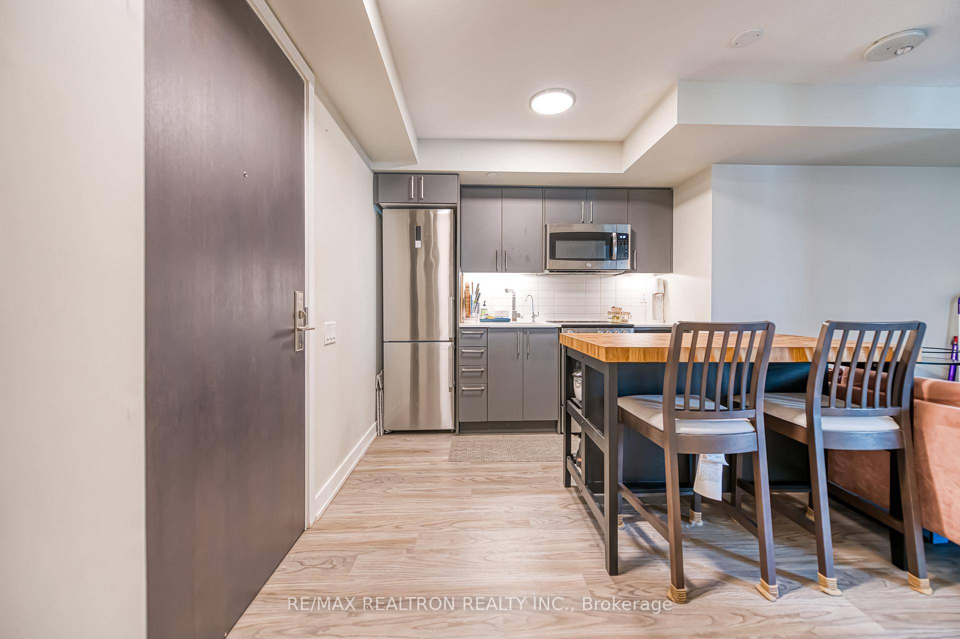 Step Into 501 38 Monte Kwinter Court A Sunlit 1 Den Unit Featuring An Open Concept Design With Sleek Laminate Flooring And A Contemporary Kitchen Outfitted With Stainless Steel Appliances ...