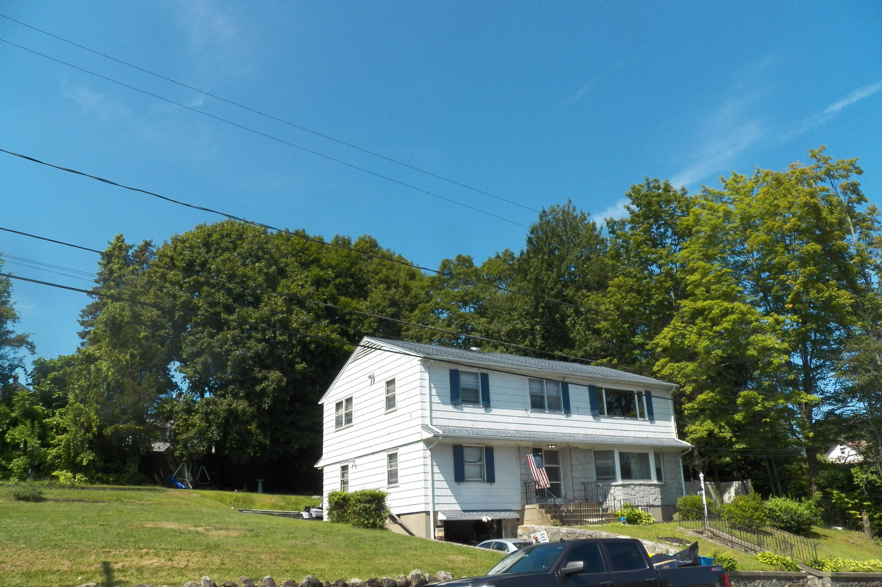 Central air on the 2nd floor accents this huge owner occupied 2 family with over 3, 000 square feet of above grade living space, hardwood floors !