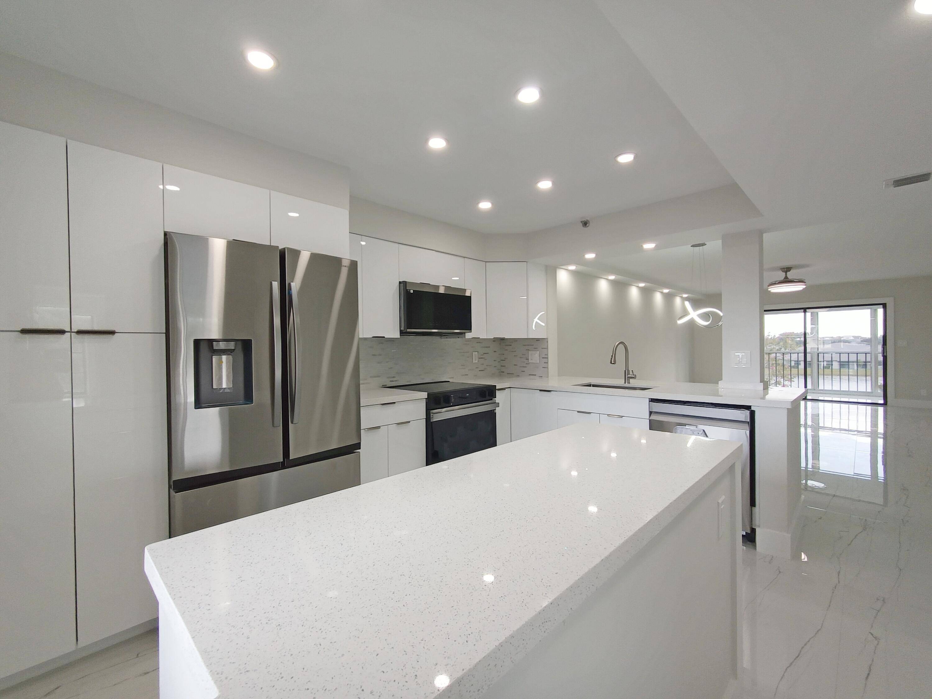 Beautiful and bright, remodeled from top to bottom LANCASTER CORNER unit with extra windows, across the street from newly renovated state of the art Clubhouse and pool next to the ...