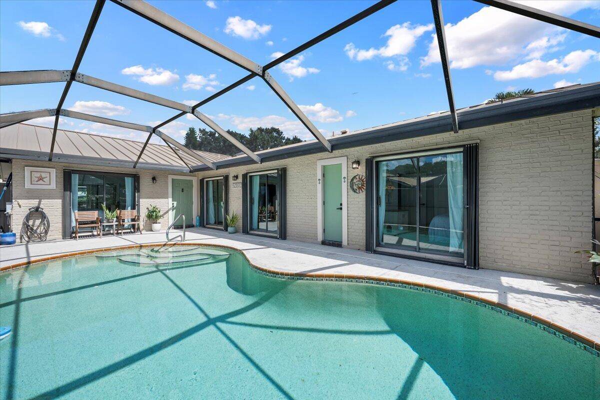 Experience Florida living at its finest in this stunning single story corner unit townhome in the highly desirable community of Westwood Gardens.