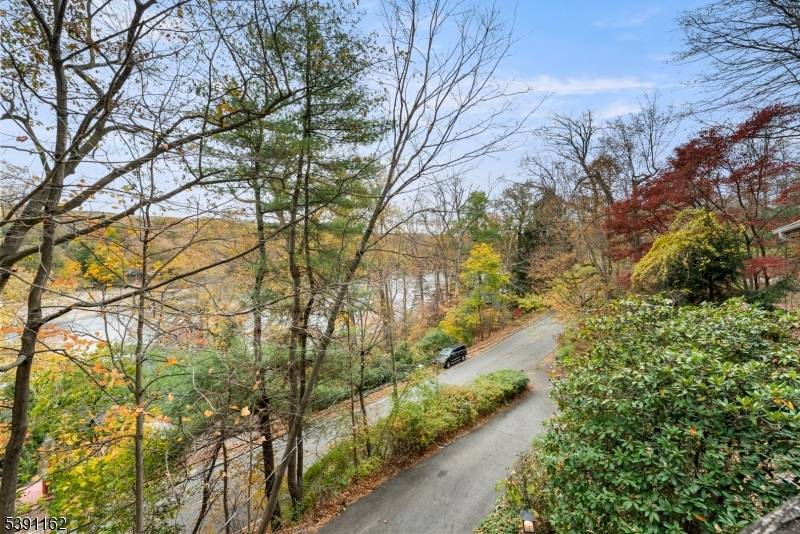 Discover this unique 4 BR, 3 bath home, perfectly positioned on a serene, wooded property in Ringwood, NJ.