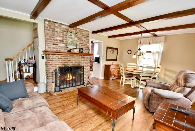 Meticulous 3 bedroom 1. 5 bath 1 car garage expanded cape cod located on park like property in a quiet neighborhood.