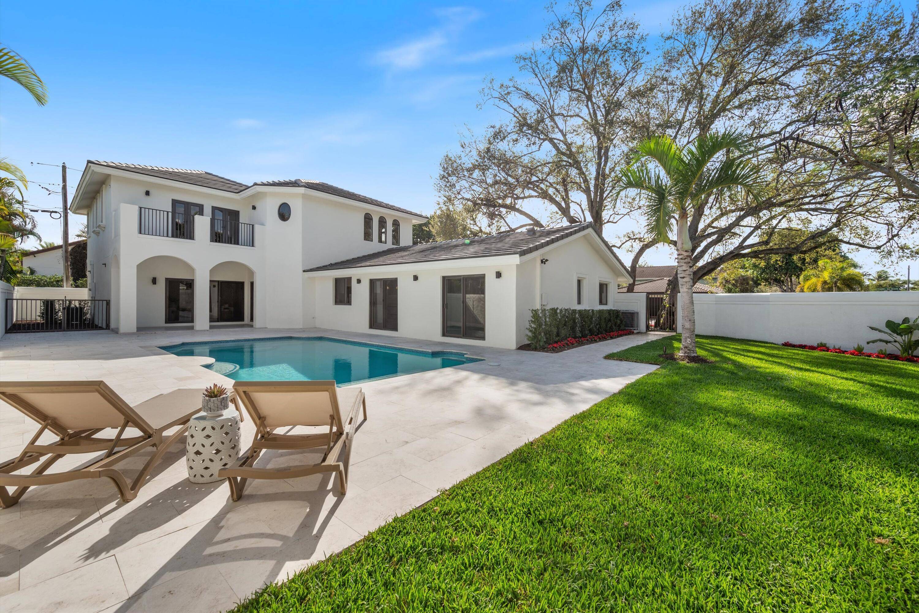 Welcome to this stunning TURN KEY home located in the sought after neighborhood of Palm Beach Farms.