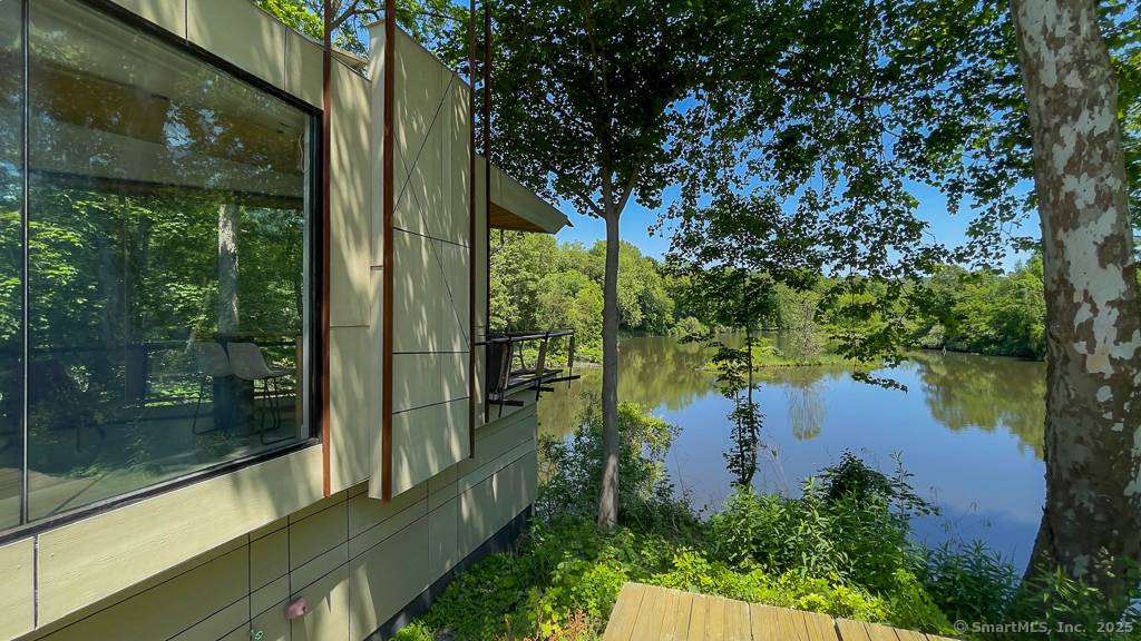 Welcome to 47 Still River Drive a stunning, modern summer rental nestled directly on the Still River, just off scenic Lake Lillinonah.
