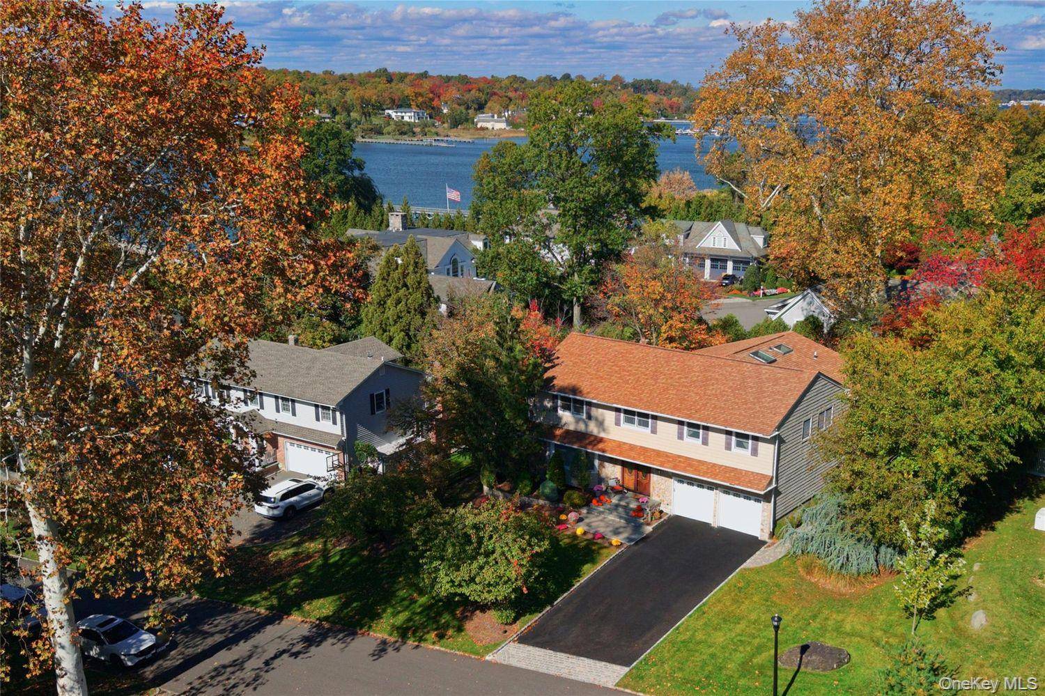 Nestled in the charming Incorporated Village of Plandome Heights, this elegant 5 bedroom, 3.