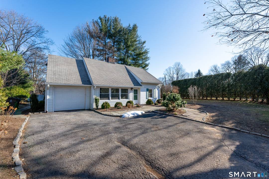 Adorable three bedroom, two full bath ranch style home with walk up attic for unlimited storage on a beautifully landscaped corner property in a convenient location minutes to everything.