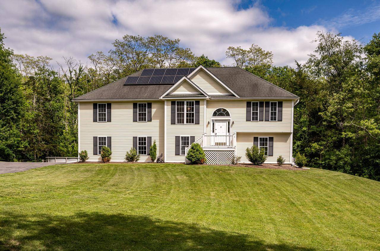 This stunning contemporary is set at the end of a long winding driveway offering privacy and tranquility on 8.