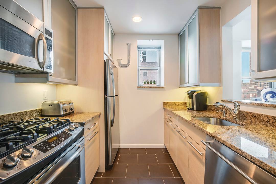 Welcome home to the unusually spacious 4A at the Bridge Condominium in East Harlem.