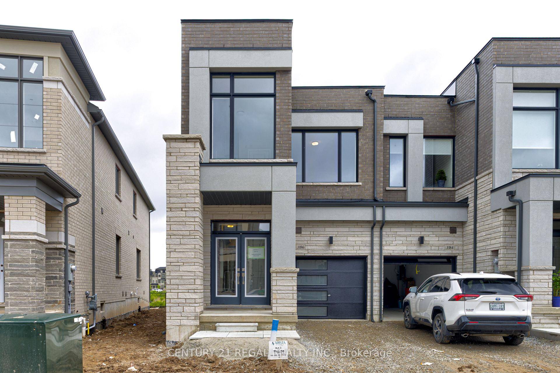 A brand new contemporary end unit townhome.