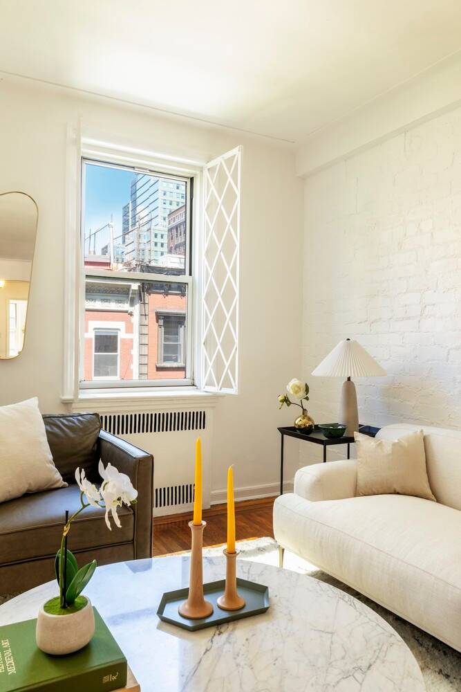 Spacious and bright corner convertible 2 bedroom apartment on the top floor of a well run and charming full service cooperative located on a tree lined street at the intersection ...