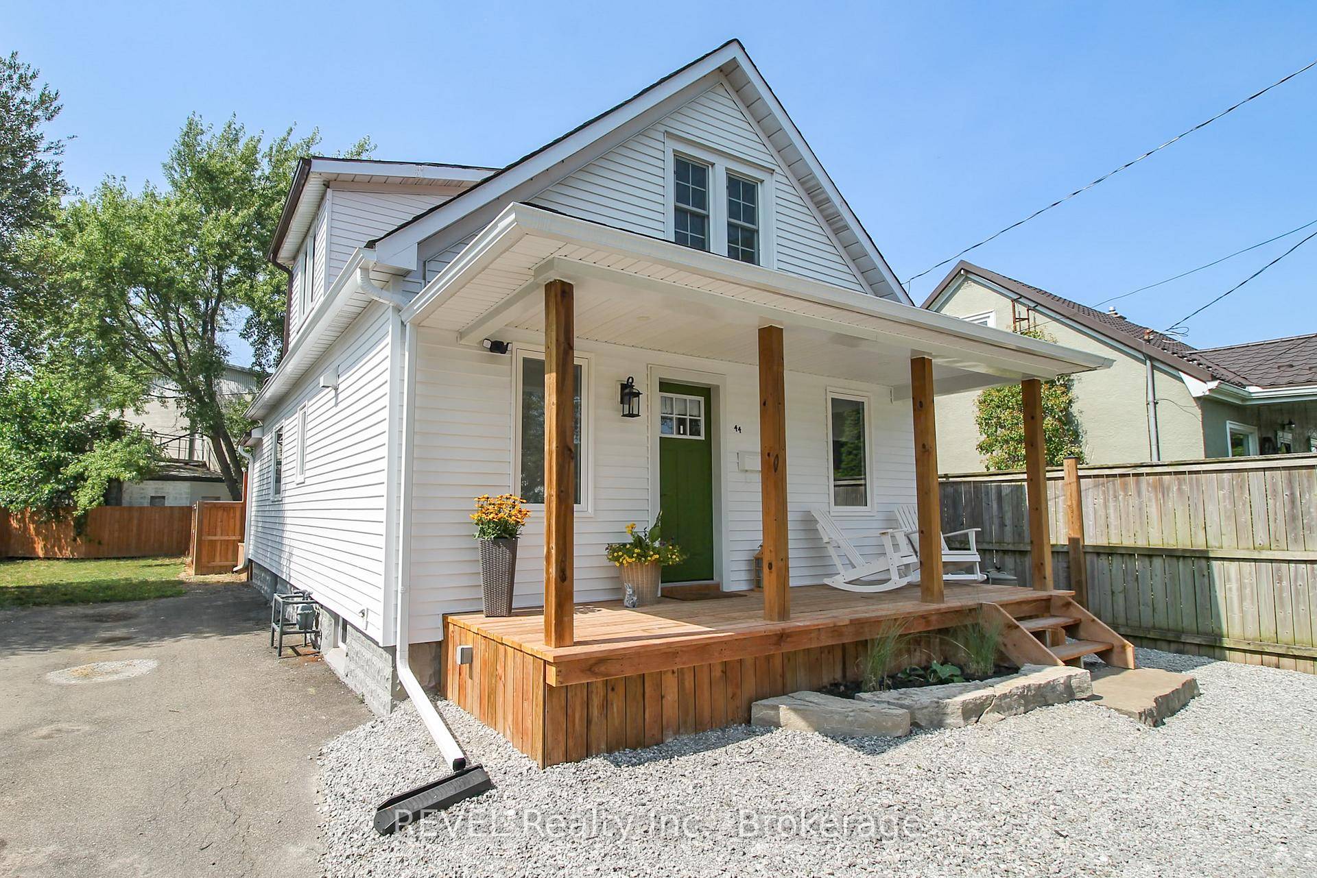 Stunning updated 1 1 2 storey home !