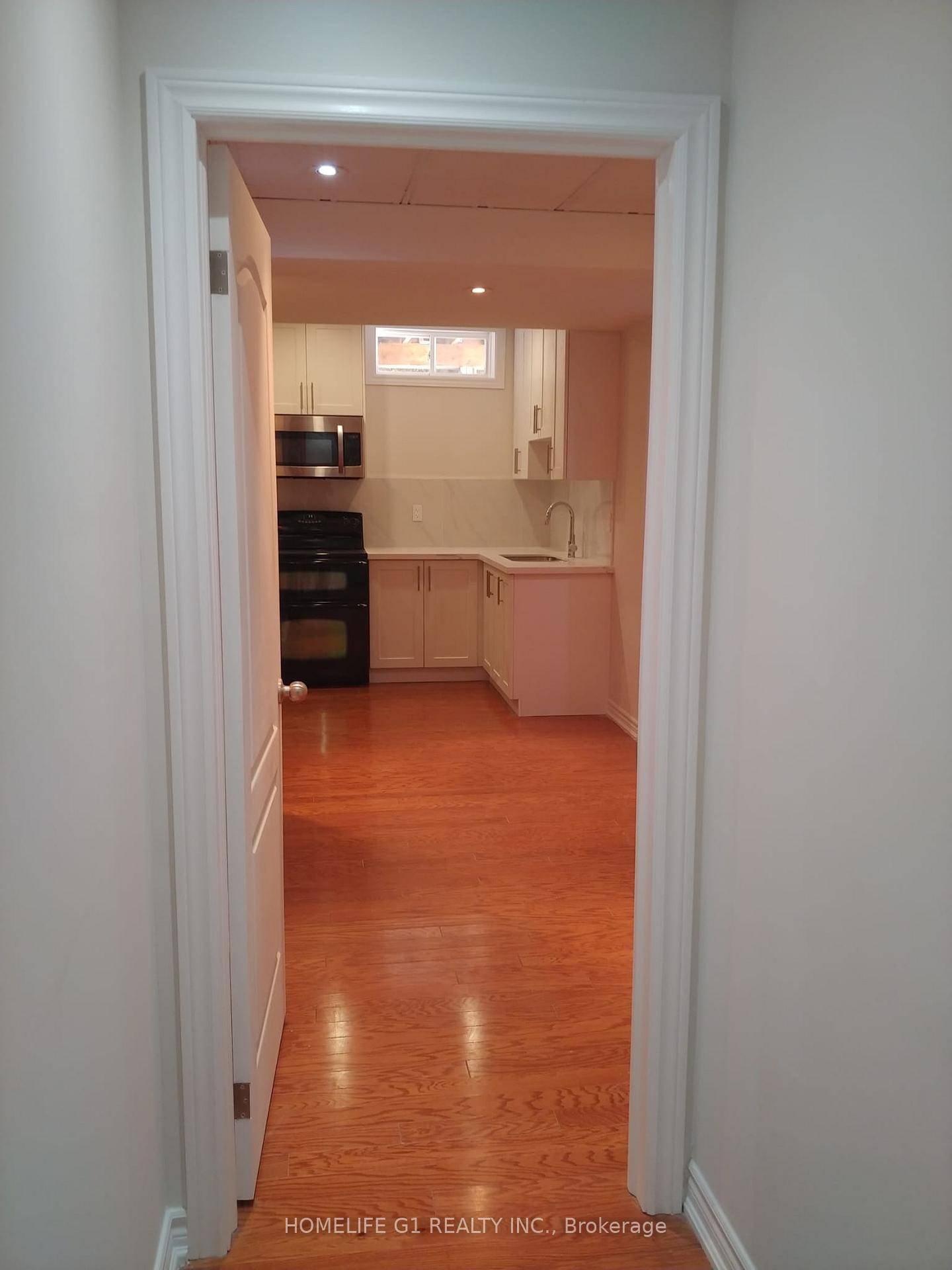 Bright and spacious basement apartment featuring one bedroom plus a den, kitchen, and full bathroom.