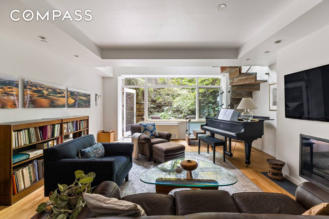 Welcome to this private oasis on West 122nd Street, where modern design meets urban living in the heart of Manhattan's Harlem Village.