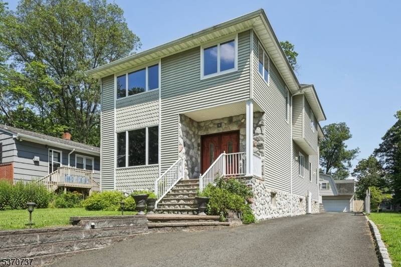 Spacious 4 5 Bedroom 2. 2 Bath Custom Colonial Home with a spacious updated eat in kitchen leading to an oversized family room ; private office space formal dining area.