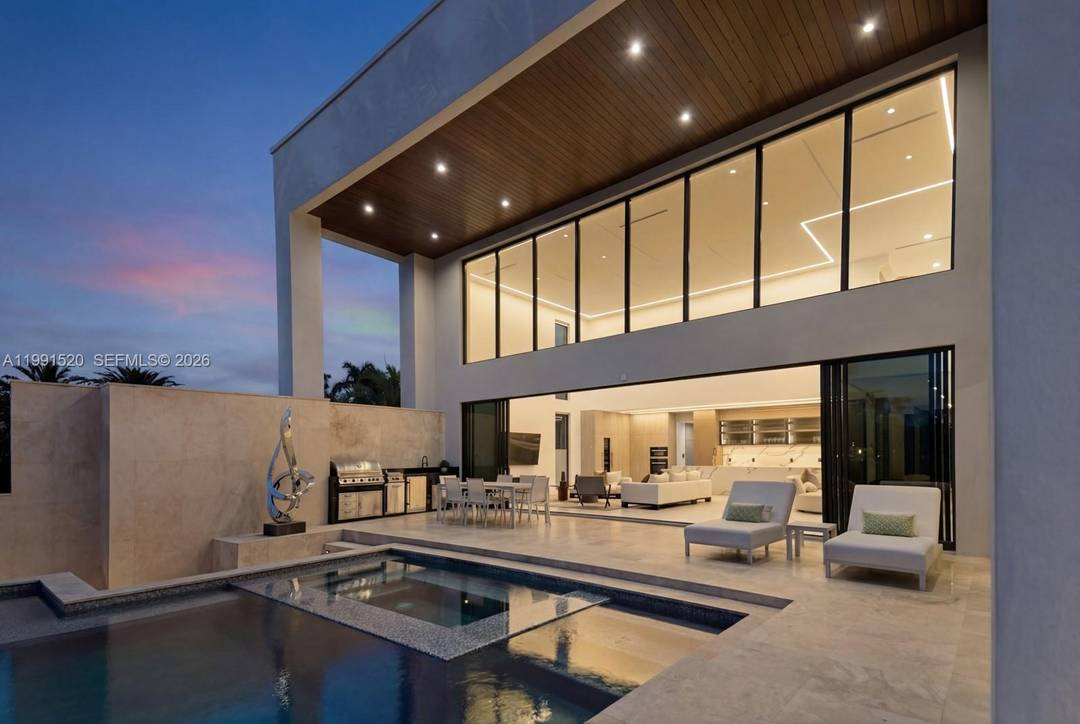 Experience elevated luxury in this newly built gated waterfront estate, nestled within the prestigious 24 7 guard patrolled community of Belle Meade.