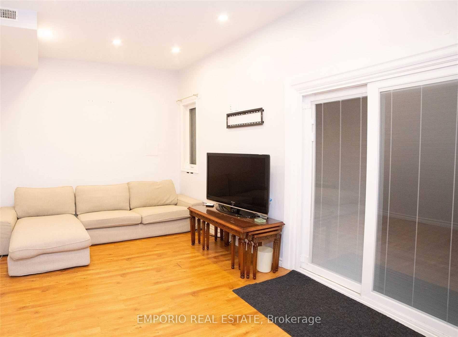 2 bedroom basement apartment featuring a spacious living room, a kitchen with full sized appliances, and bright finishes throughout.