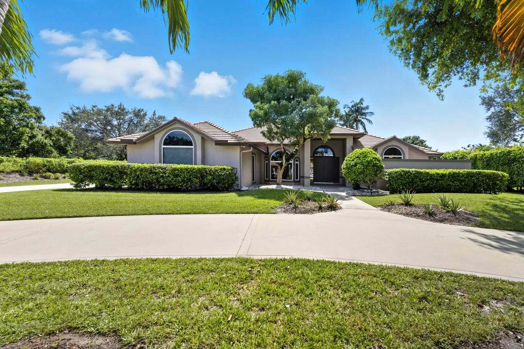 Nestled within the prestigious gated community of Steeplechase, this one story residence offers timeless comfort, thoughtful design, and over an acre of lush privacy.