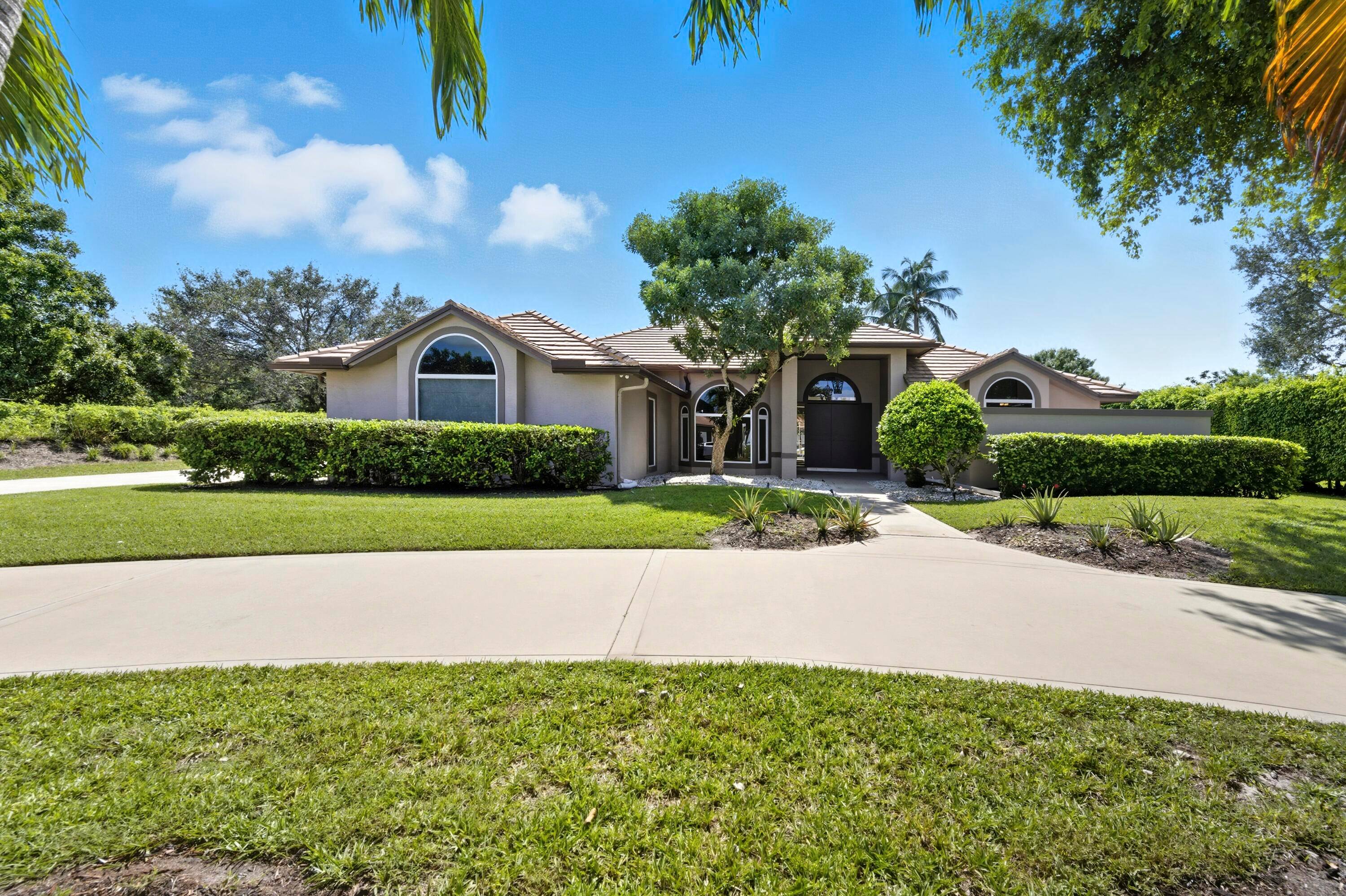 Nestled within the prestigious gated community of Steeplechase, this single story residence offers timeless comfort, thoughtful design, and over an acre of lush privacy.