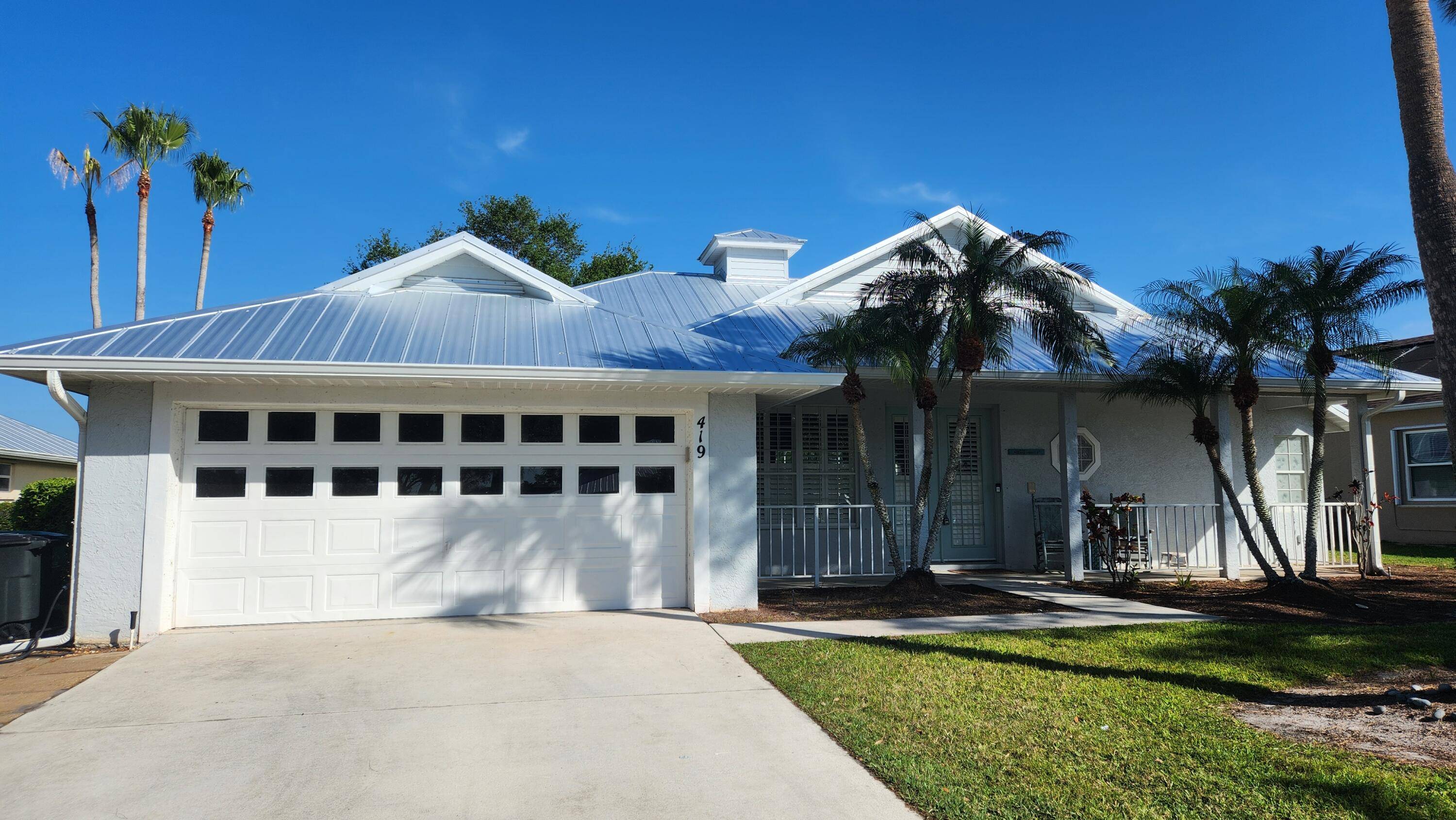 Lake Front Beauty... Enjoy this Key West Style Pool Home with a Brand New Metal Roof !