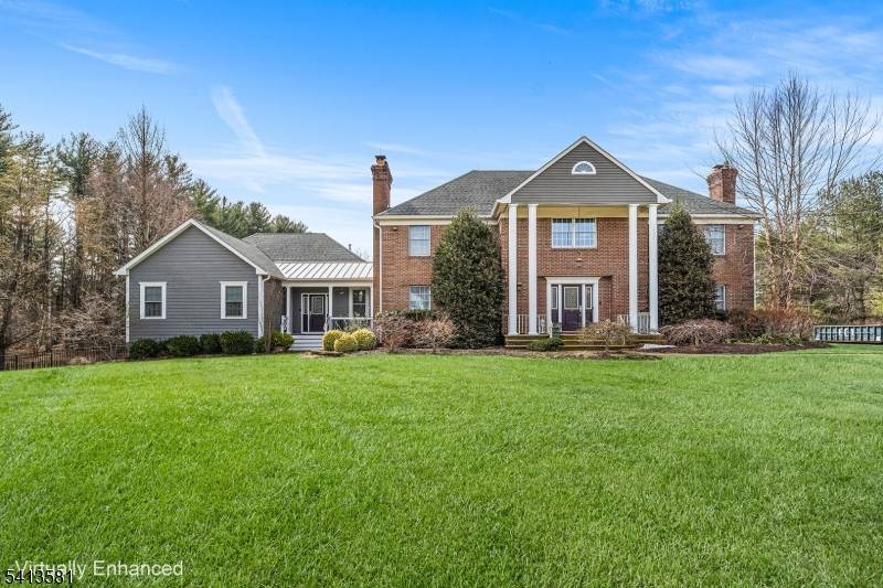 Welcome to an exceptional 5, 147 sq ft multi generational home nestled on a quiet cul de sac surrounded by beautifully preserved wooded land offering privacy, tranquility timeless charm.
