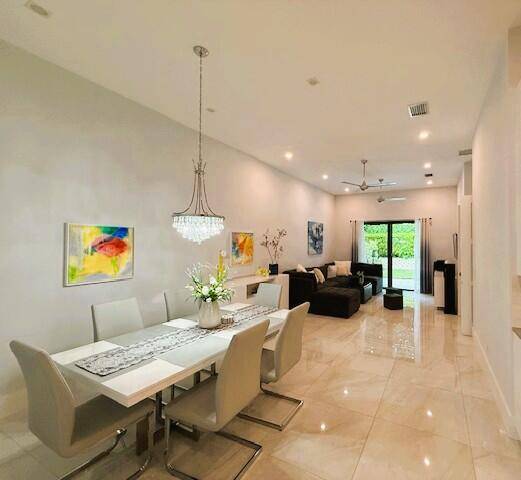 Contemporary fully furnished townhome built at the end of 2019, tall ceilings, with open layout kitchen design with high cabinets and high end stainless steel appliances, two bathrooms with high ...