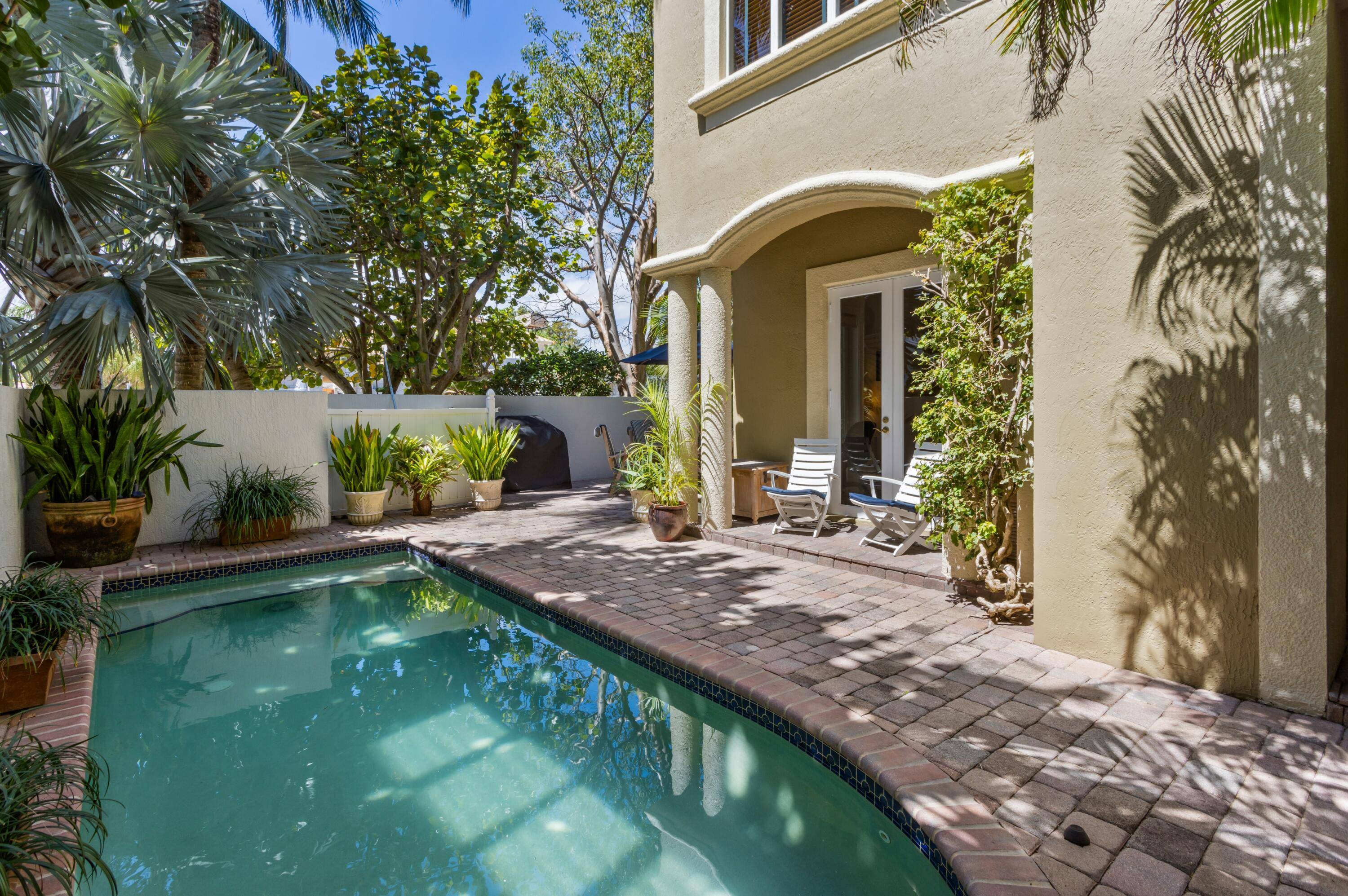 SATURNIA BY THE SEA, AN EXCLUSIVE TOWNHOME COMMUNITY JUST ACROSS FROM THE BEACH IN THE PRESTIGIOUS ESTATES SECTION OF BOCA RATON.