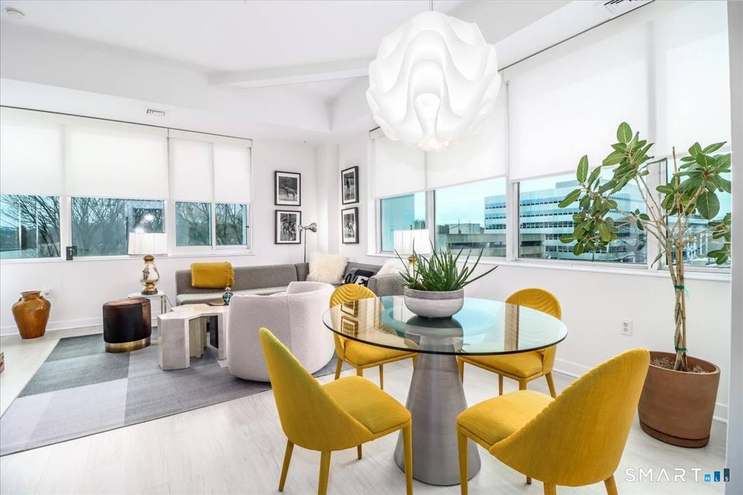 Sophisticated living can be yours in this sunny 2 bedroom, 2 bath flat featuring high ceilings, walls of noise reducing windows modern design for easy living entertaining.