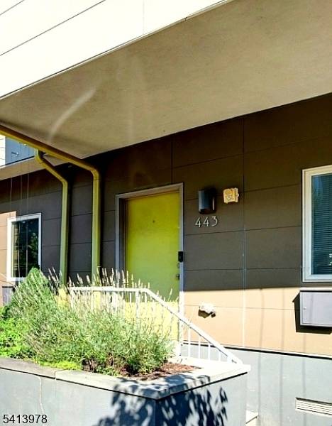 3BR, 2. 1BA three story condo with high ceilings and abundant natural light, creating an open and airy feel throughout.