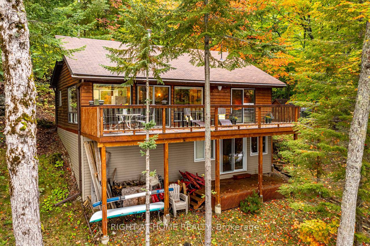 Experience the Ultimate in Lakeside Living Turnkey Waterfront Cottage on South Portage Lake !