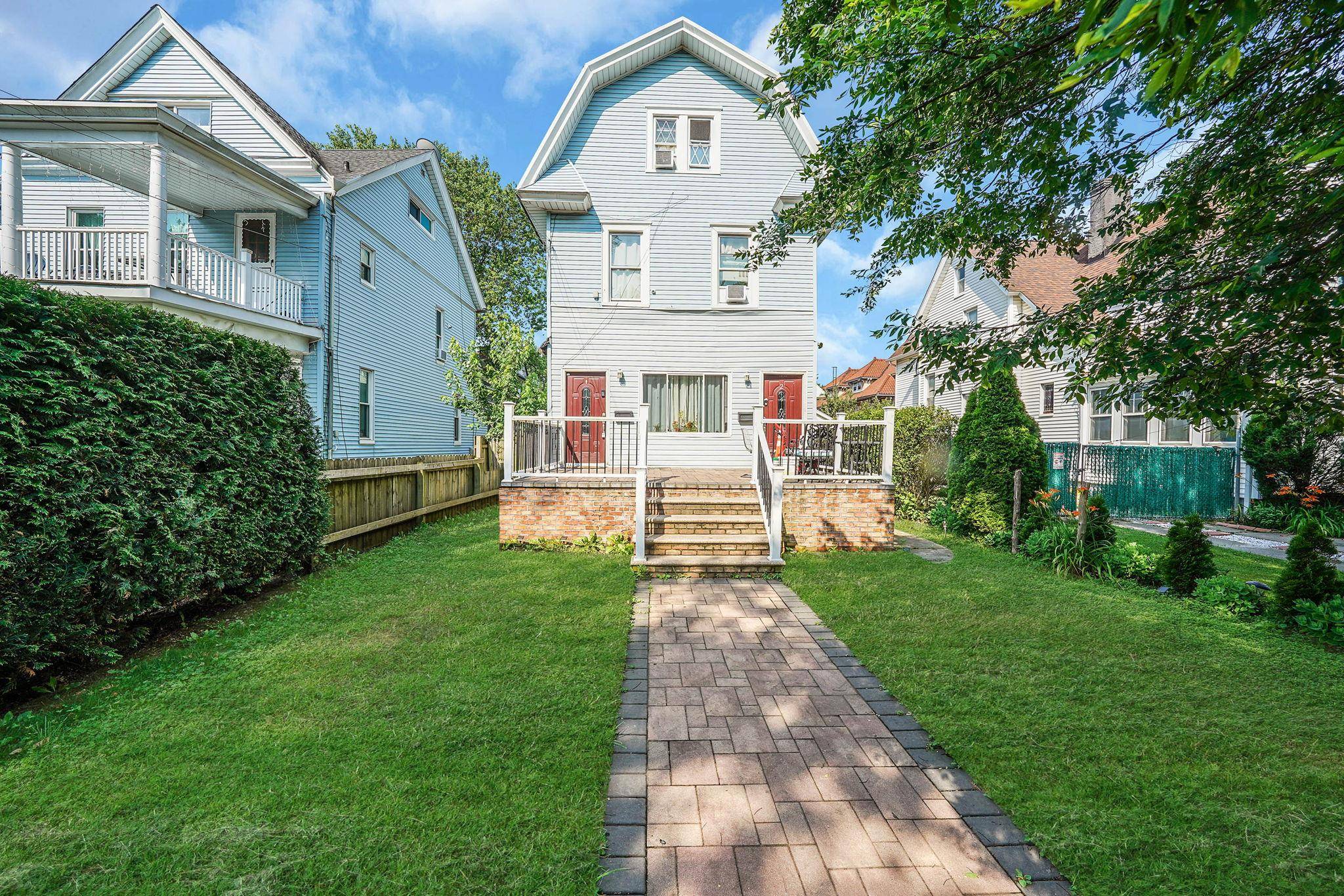 Discover a rare opportunity to own a fully legal 3 family home in the heart of Richmond Hill, perfectly positioned for both comfortable living and strong rental income.