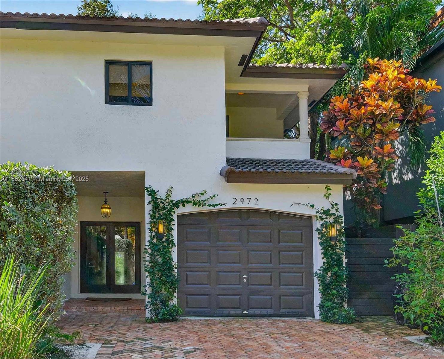 Experience refined Coconut Grove living in this stylish 3 BR, 2.