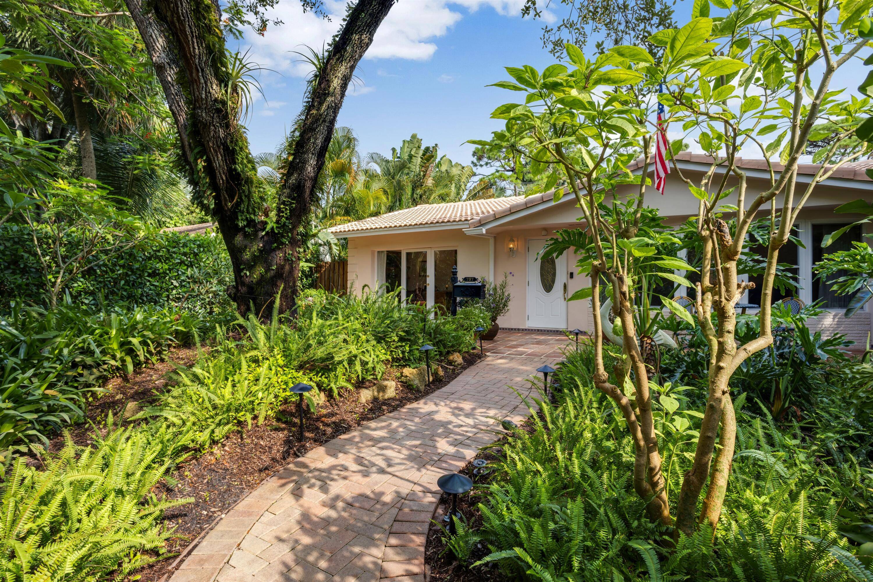 In an exquisite setting and radiating the charm of its era, this beautifully maintained residence is ideal for embracing South Florida's coveted lifestyle.