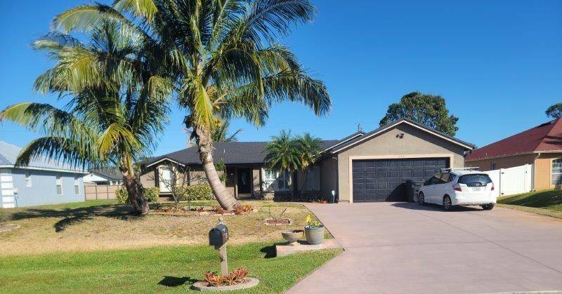 This 3 2 2 pool home has an extra wide driveway to fit a boat or RV.