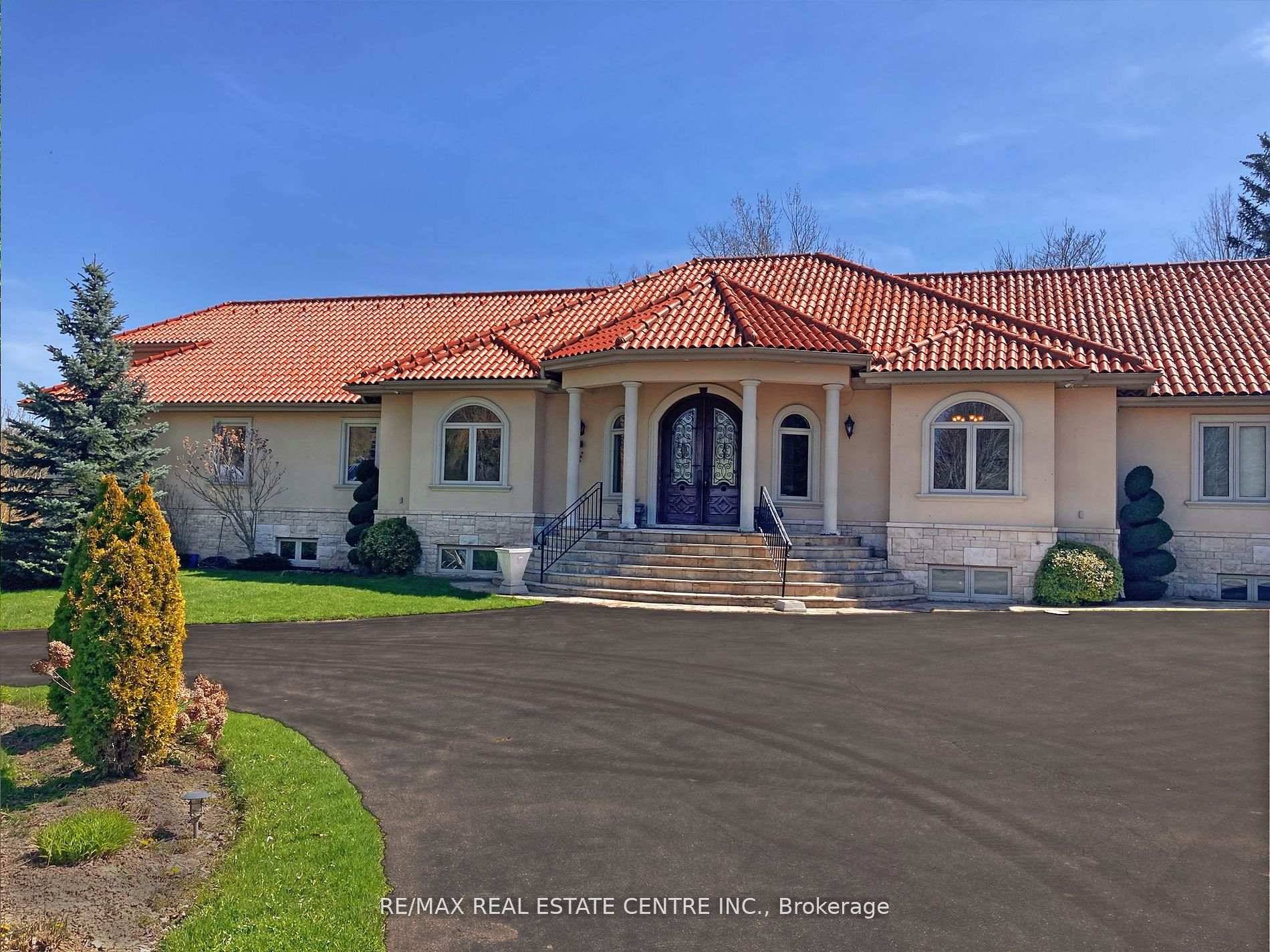 Discover your personal paradise nestled in the enchanting beauty of Terra Cotta a remarkable 11 acre estate featuring a nearly 2 acre spring fed private lake brimming with wildlife.