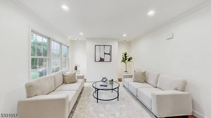 Move right in ! Discover the perfect blend of sophistication and space in this beautifully expanded home featuring 6 bedrooms and 4.