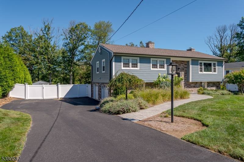 Stunning 3 bed, 2 full bath Bi level home with sunroom and incredible outdoor kitchen in desirable Warren Township.