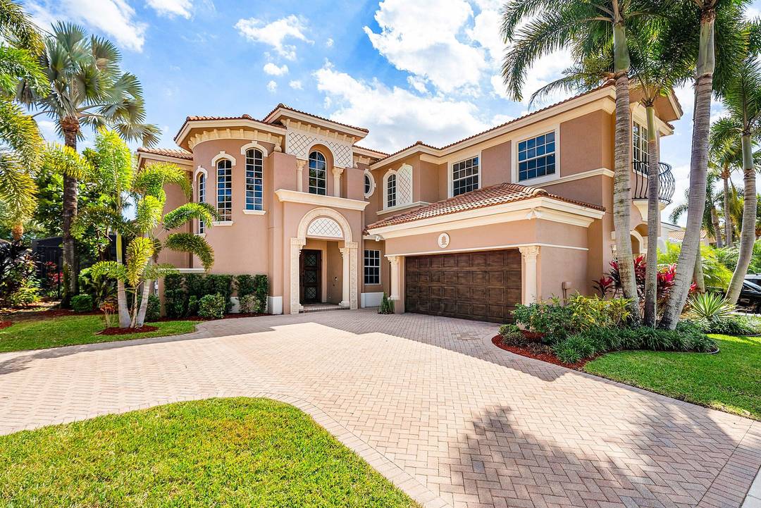 Elegant Mediterranean estate in the highly sought after Mizner Country Club, This beautiful two story home features 4 bedrooms, 5 full baths, and stunning golf course views.
