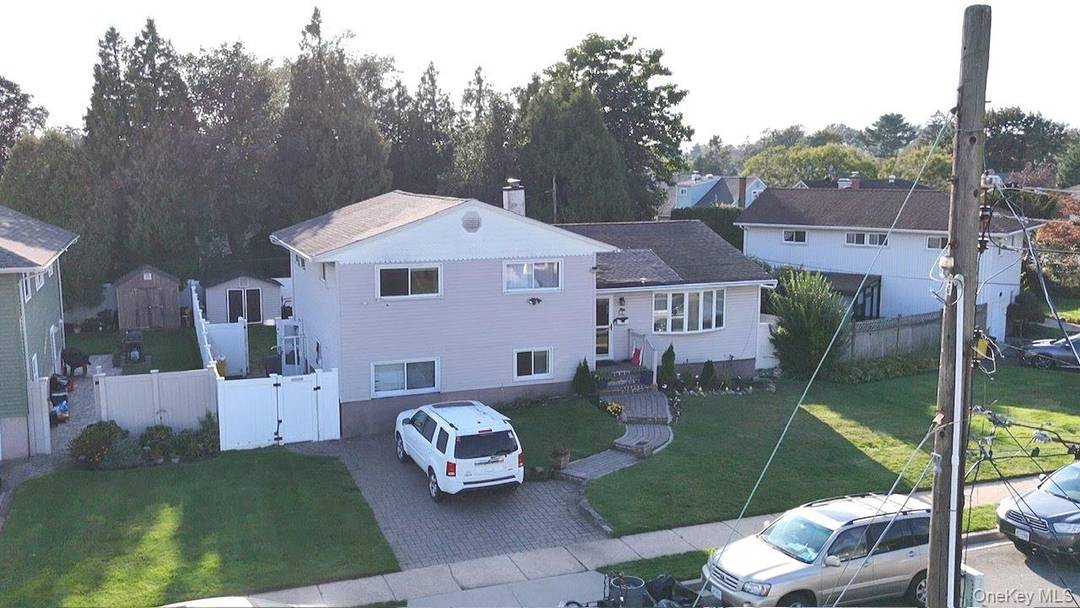 Welcome to this beautiful Spacious split level home in a heart of Hicksville.