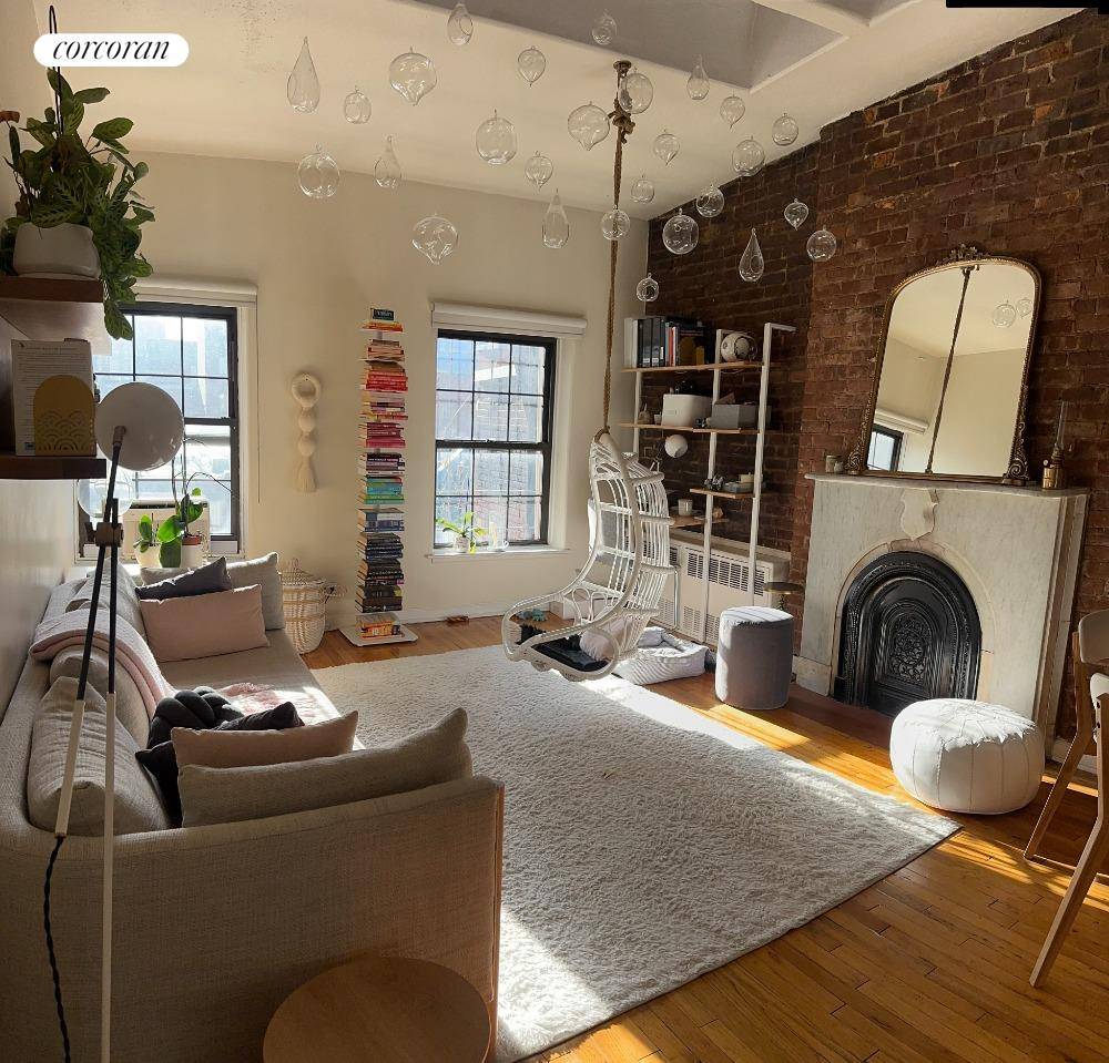 South facing one bedroom with pre war details such as exposed brick, hardwood floors and decorative fireplace.