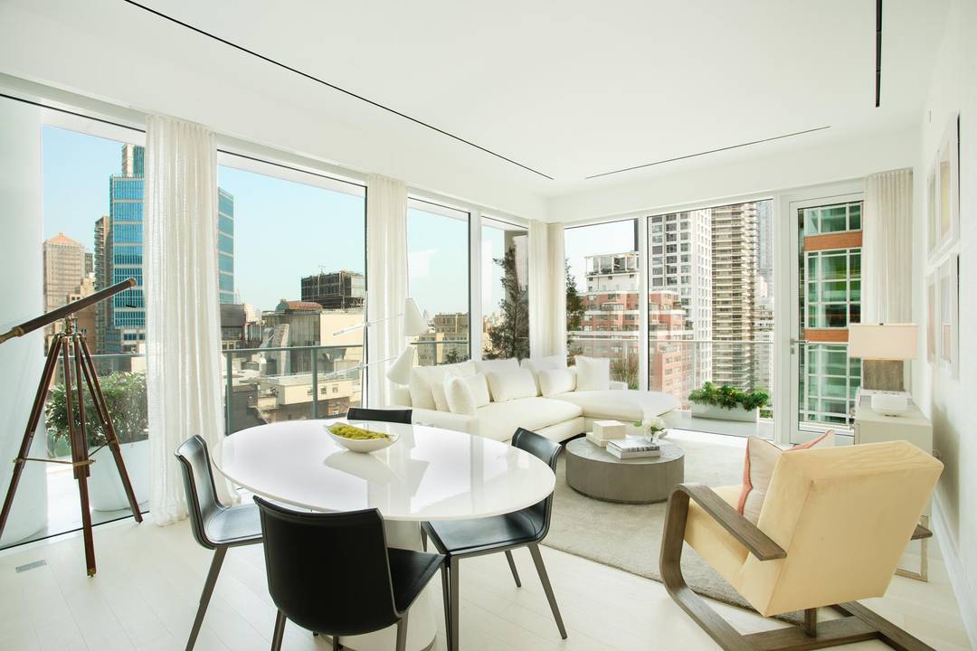This spacious, corner 1, 416 square foot two bedroom, two and a half bath residence features a deep wraparound terrace overlooking Central Park, and western views of the Midtown skyline.