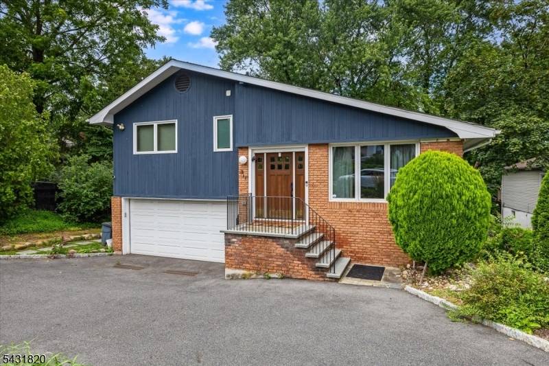 Fully renovated, light filled split level home in Montrose with soaring vaulted ceilings and an open, modern layout.