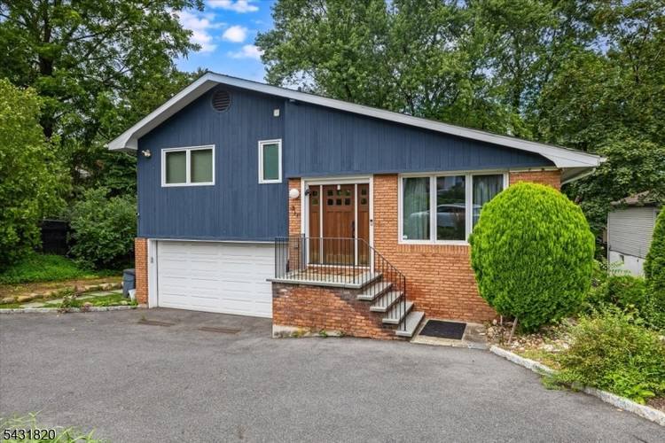 Fully renovated, light filled split level home in Montrose with soaring vaulted ceilings and an open, modern layout.
