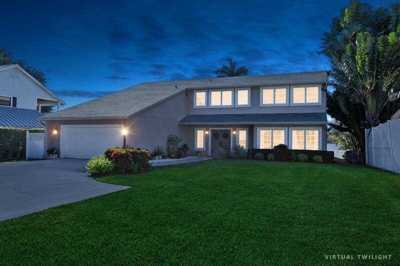 Welcome to this Stunning Remodeled Lakefront Oasis with Timbertech Dock, Deck, Lift Pool on Lake Osborne, where luxury meets lakefront tranquility.