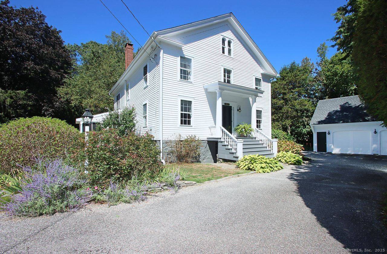 Nestled in the heart of Madison Village, this exquisite Greek Revival style home offers unparalleled privacy.