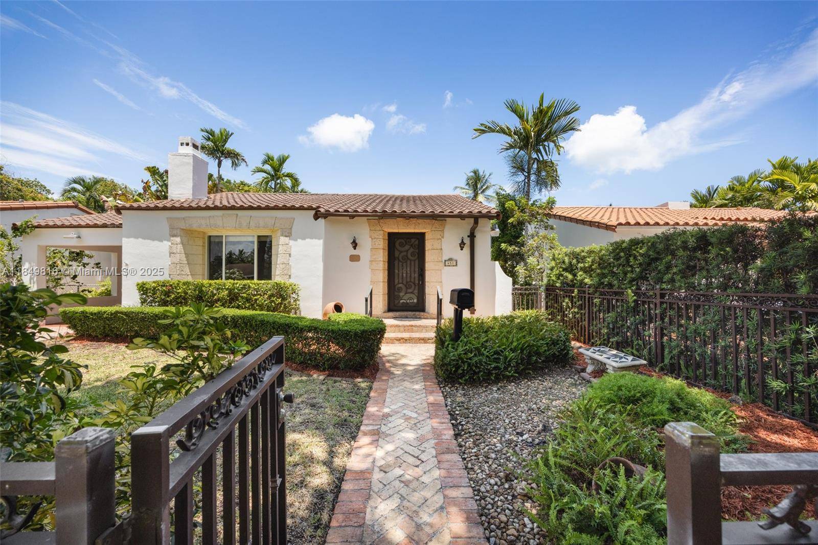 Charming home in The Roads with unbeatable curb appeal and fully gated.