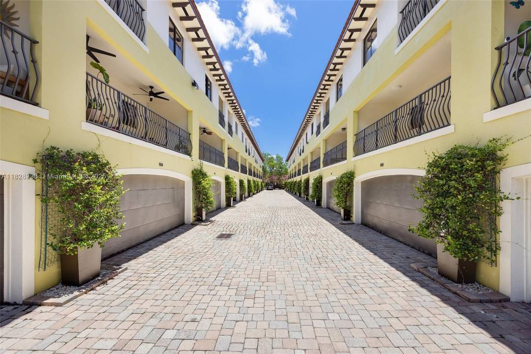 Beautiful tri level townhome in a gated community in the heart of Coconut Grove.