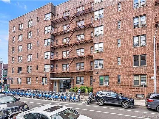 Brilliant sunlight pours into this extra large two bedroom home office perched on the top floor of a beautifully maintained Elmhurst condo.