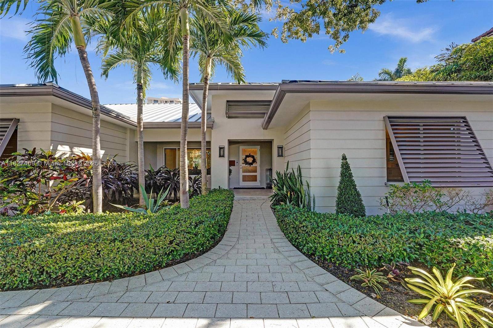 Immaculate single story Key West style beach home on one of the most desired streets in Harbor Beach, an elite private residential community.